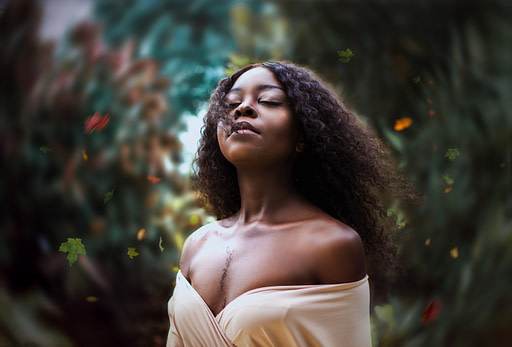 Calm Woman in wind | TOP 25 health and wellness rituals to nurture your body and mind