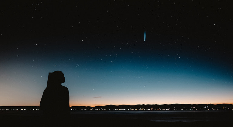 Woman and the night sky | 10 best holiday gift ideas for meaningful gifts